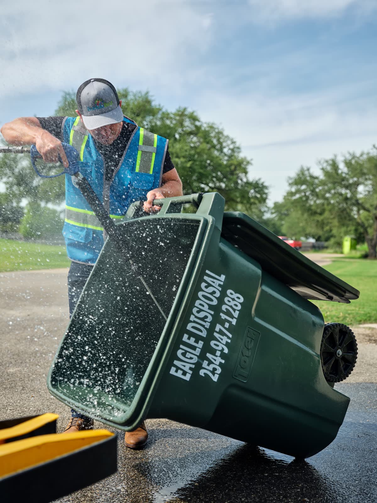 Bubble Binz technician pressure washing a residential trash can in Las Vegas